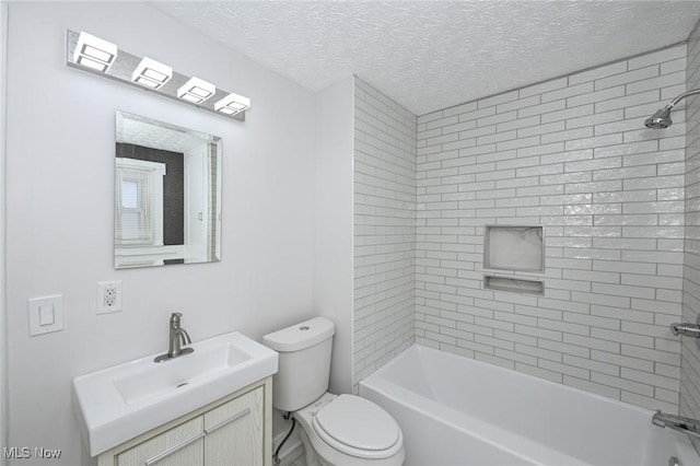 full bath with  shower combination, toilet, a textured ceiling, and vanity