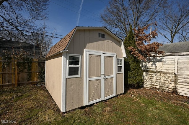 view of shed featuring a fenced backyard