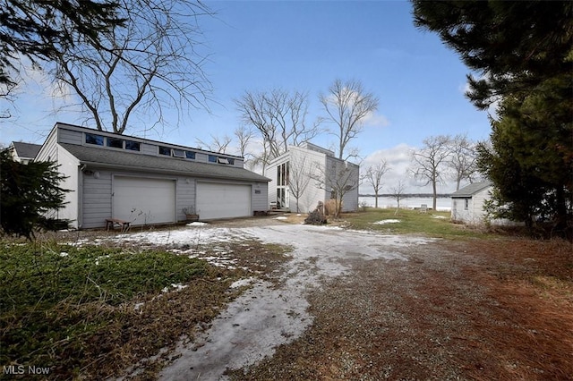 view of side of home with a garage