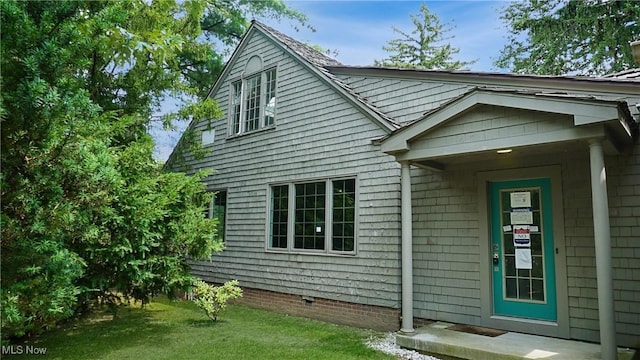 exterior space featuring crawl space and a yard