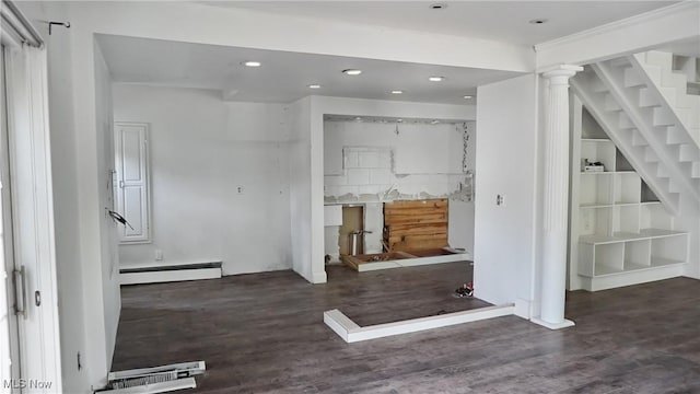 interior space with a baseboard radiator, stairway, recessed lighting, and wood finished floors