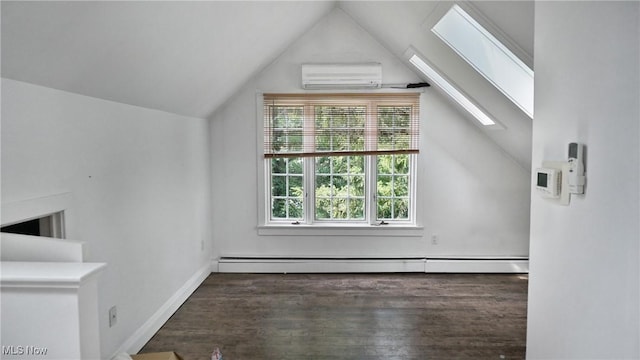 additional living space with vaulted ceiling with skylight, wood finished floors, baseboards, an AC wall unit, and baseboard heating