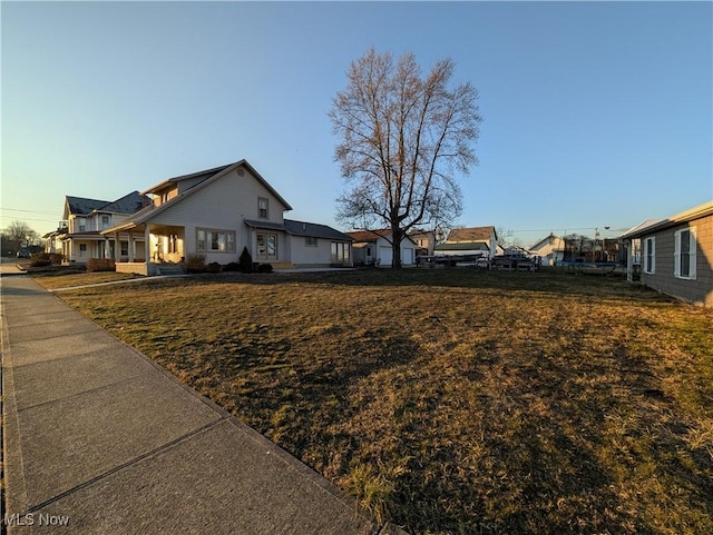 view of property exterior with a lawn