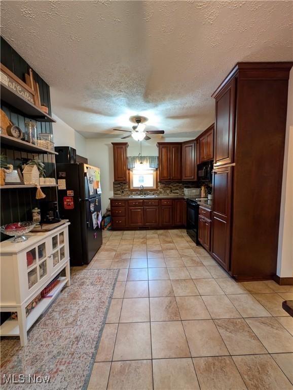 kitchen featuring open shelves, light tile patterned floors, a ceiling fan, a sink, and black appliances