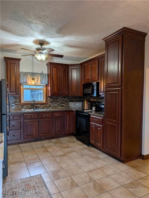 kitchen with black appliances, a sink, a ceiling fan, and decorative backsplash