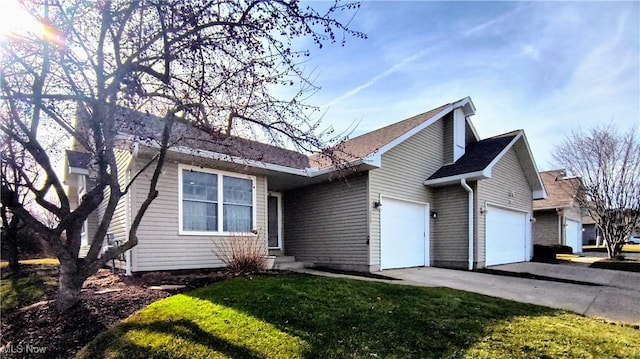 single story home featuring a garage, concrete driveway, and a front yard