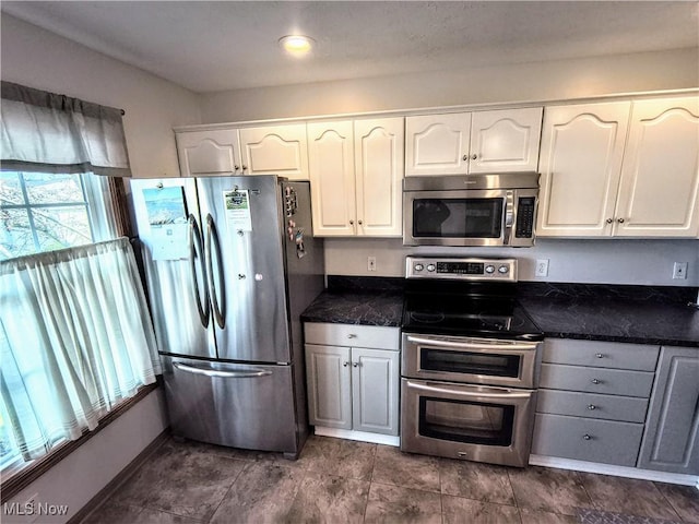 kitchen featuring appliances with stainless steel finishes and white cabinetry