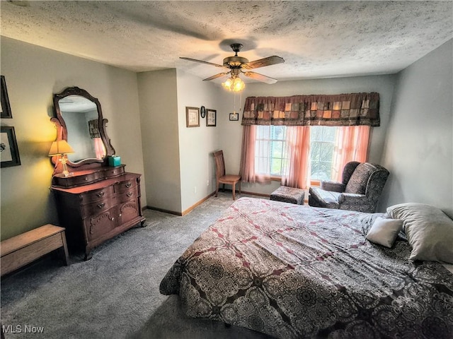 carpeted bedroom featuring a textured ceiling, ceiling fan, and baseboards