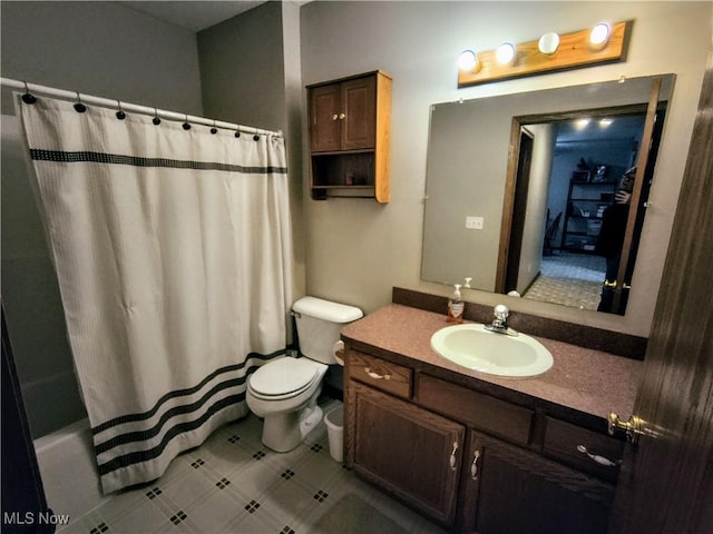 full bath featuring shower / bath combo, vanity, and toilet