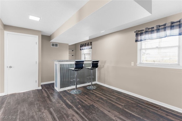 14045 Mahoning Ave, Lake Milton, OH 44451 - bar featuring baseboards, visible vents, a dry bar, and wood finished floors
