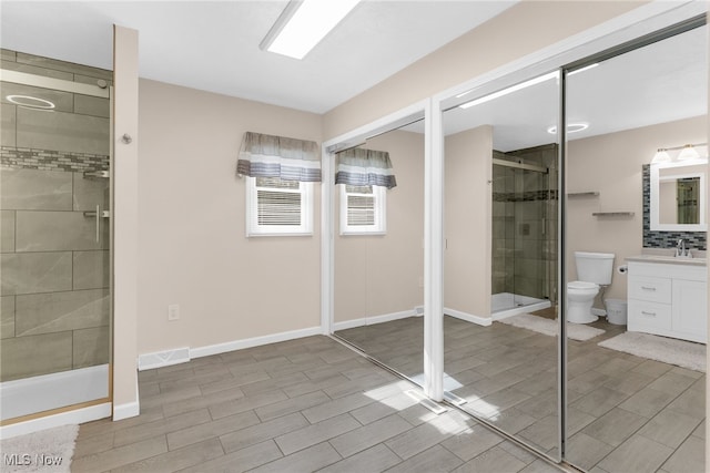14045 Mahoning Ave, Lake Milton, OH 44451 - bathroom featuring toilet, wood finish floors, visible vents, vanity, and a stall shower