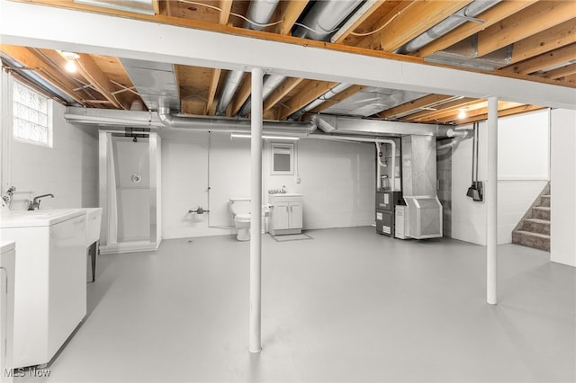 14045 Mahoning Ave, Lake Milton, OH 44451 - basement featuring washing machine and dryer, stairway, and heating unit