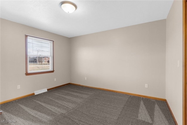 14045 Mahoning Ave, Lake Milton, OH 44451 - spare room with carpet floors, baseboards, and visible vents