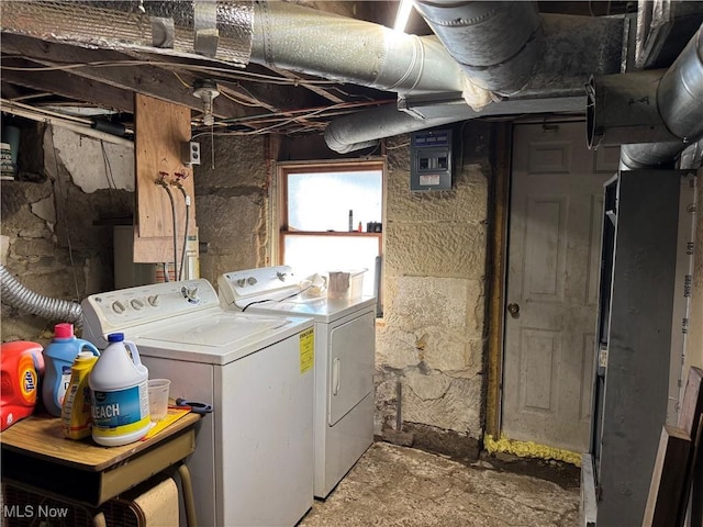 washroom featuring laundry area and washer and dryer