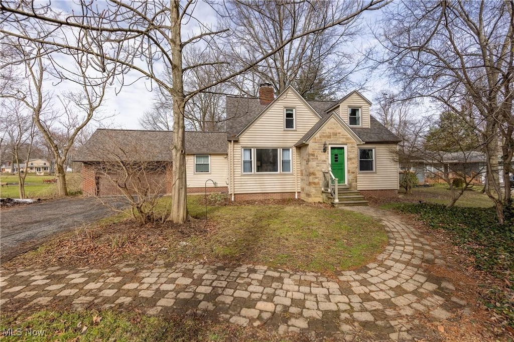 6799 Wilson Mills Rd, Gates Mills, OH 44040 - cape cod-style house featuring entry steps, roof with shingles, and a chimney