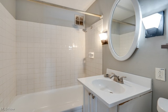 full bathroom with toilet, washtub / shower combination, and vanity