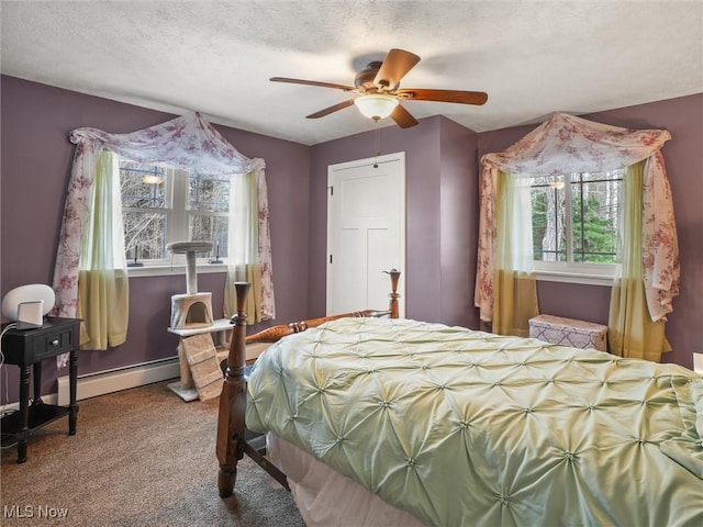 carpeted bedroom featuring a textured ceiling, ceiling fan, a baseboard radiator, and baseboards