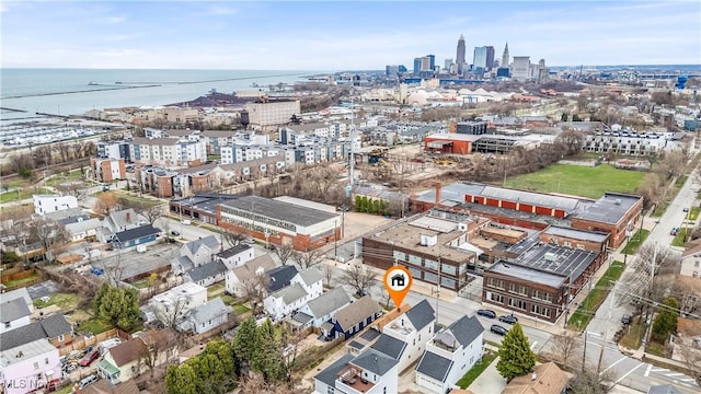 birds eye view of property featuring a water view and a city view