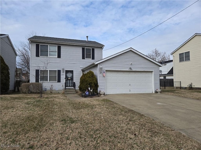 traditional home featuring entry steps, an attached garage, fence, driveway, and a front lawn