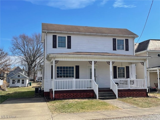 view of front of house featuring a front lawn and a porch