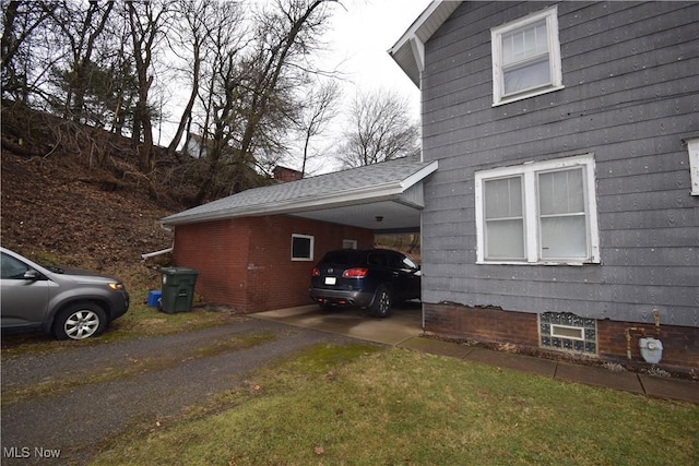 view of side of property with an attached carport