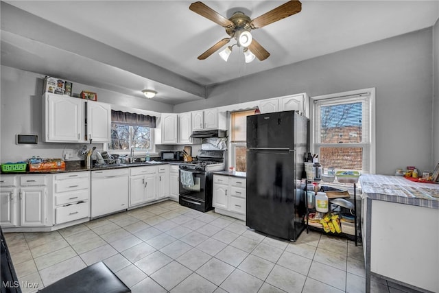 kitchen with under cabinet range hood, black appliances, white cabinetry, a sink, and light tile patterned flooring