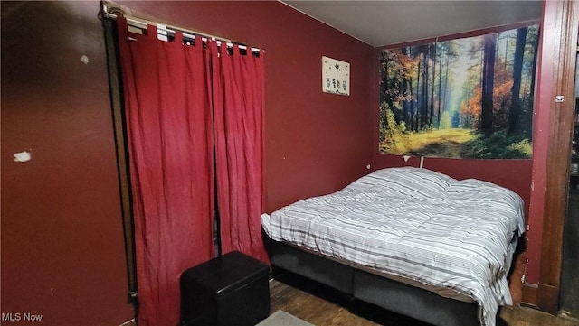 bedroom featuring wood finished floors