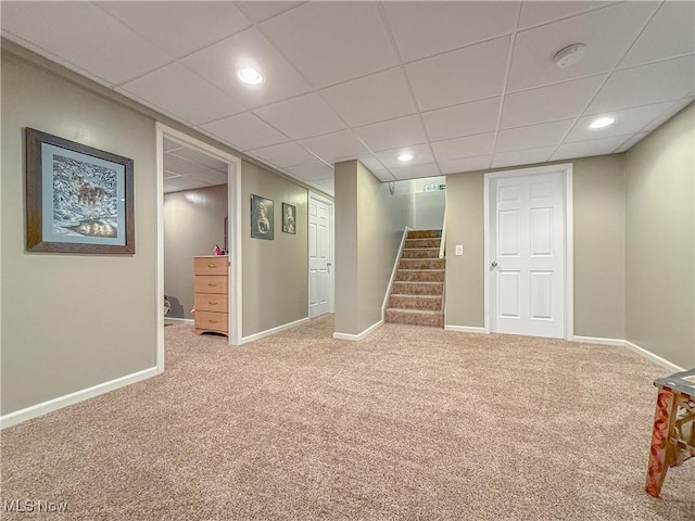 finished basement featuring carpet, stairs, baseboards, and recessed lighting