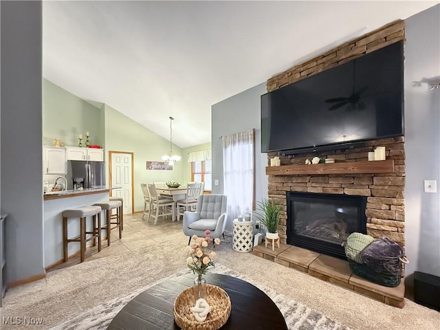 living area featuring lofted ceiling, light carpet, light tile patterned flooring, and a stone fireplace