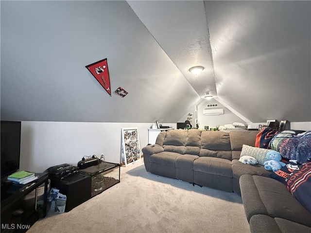 carpeted home theater featuring a wall unit AC and vaulted ceiling