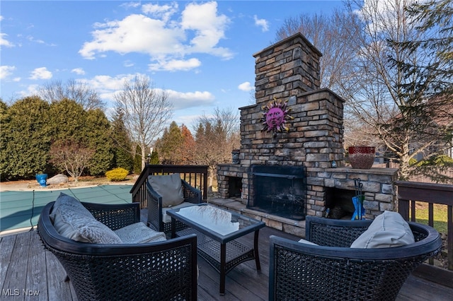 616 Coventry Pl, Amherst, OH 44001 - deck featuring a covered pool and an outdoor living space with a fireplace