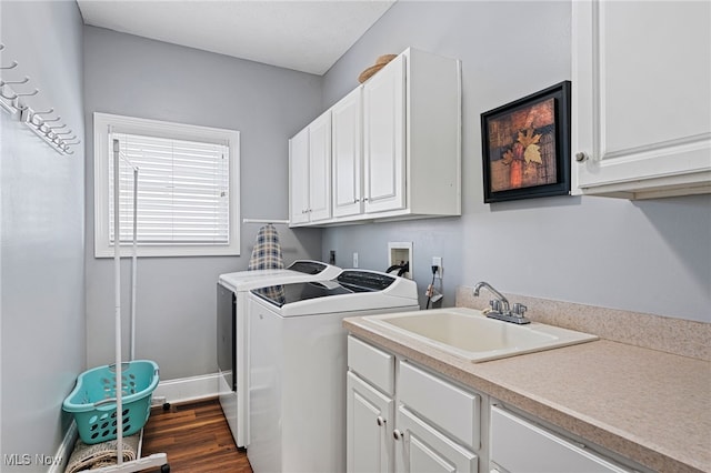 616 Coventry Pl, Amherst, OH 44001 - laundry room featuring dark wood finished floors, cabinet space, a sink, washer and dryer, and baseboards