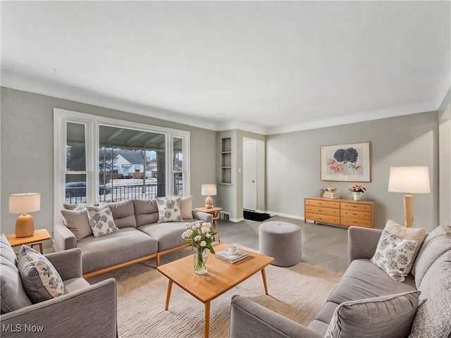 living room with carpet floors and baseboards