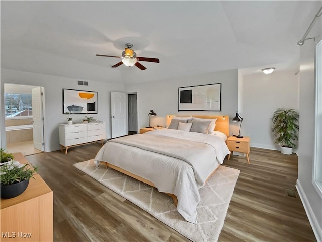 bedroom with baseboards, wood finished floors, visible vents, and a ceiling fan