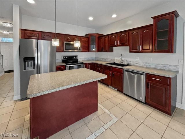 kitchen with stainless steel appliances, recessed lighting, a sink, and dark brown cabinets