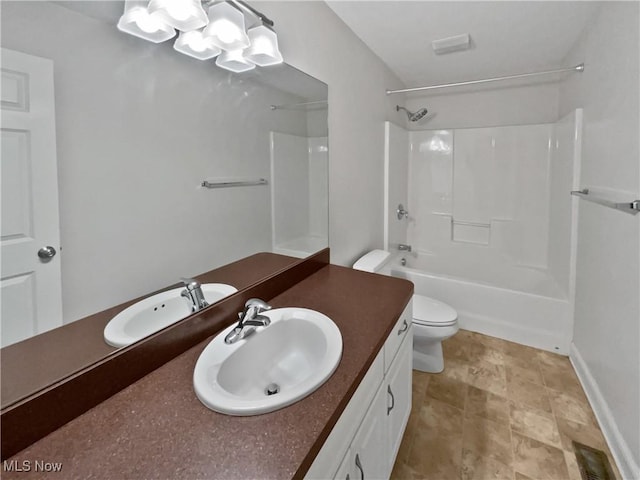 full bath with toilet, vanity, baseboards, washtub / shower combination, and an inviting chandelier