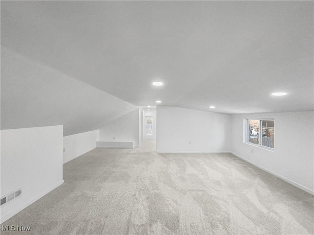 bonus room with visible vents, baseboards, lofted ceiling, carpet, and recessed lighting