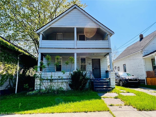 view of front of house featuring a porch and a balcony