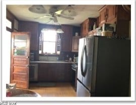 kitchen featuring ceiling fan and freestanding refrigerator