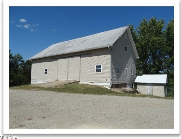 exterior space featuring an outbuilding