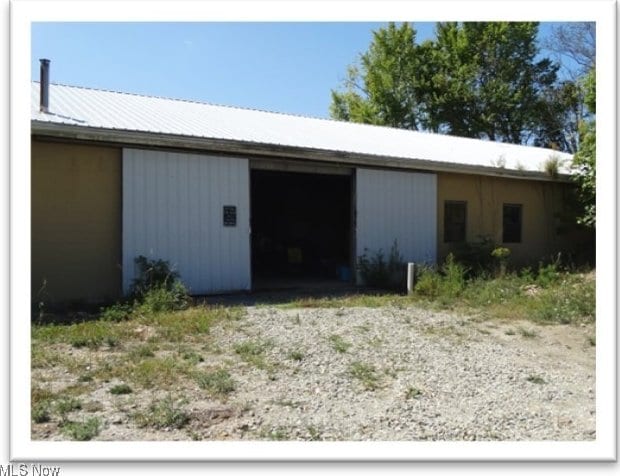 detached garage featuring driveway