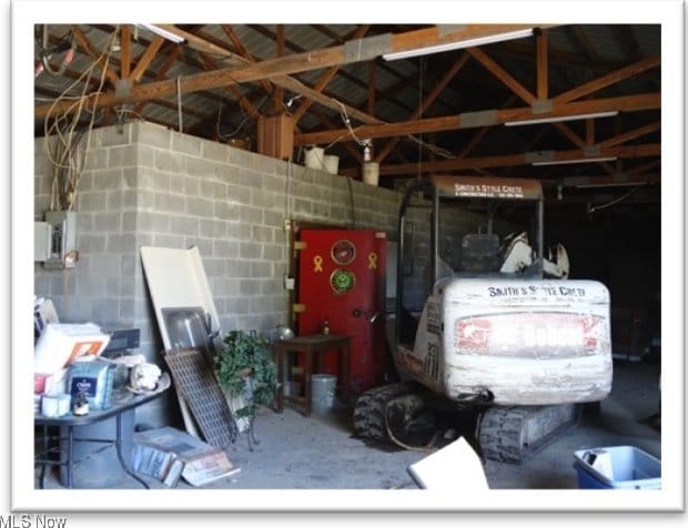 interior space with concrete block wall