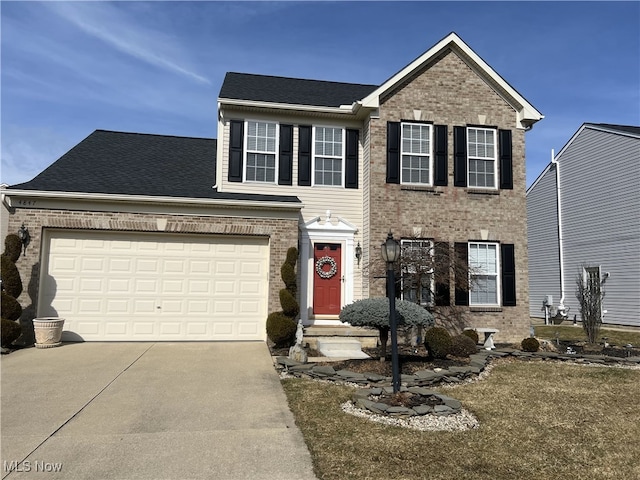 view of front facade featuring a garage, brick siding, and driveway