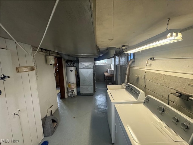 laundry room with gas water heater, independent washer and dryer, heating unit, and laundry area