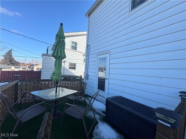 view of patio with fence and outdoor dining space