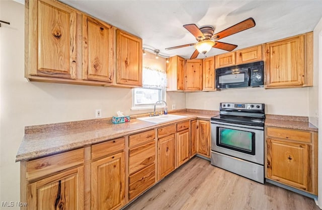 kitchen with light wood-style flooring, a sink, ceiling fan, black microwave, and stainless steel electric range