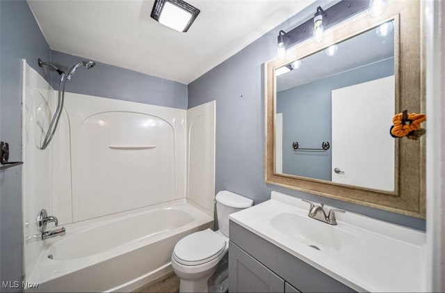 full bathroom with tub / shower combination, vanity, and toilet