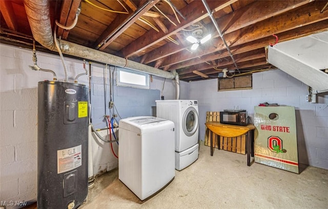 laundry area with laundry area, separate washer and dryer, and electric water heater