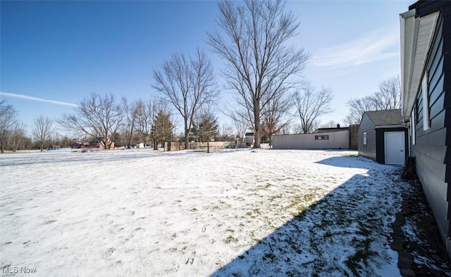 view of yard layered in snow