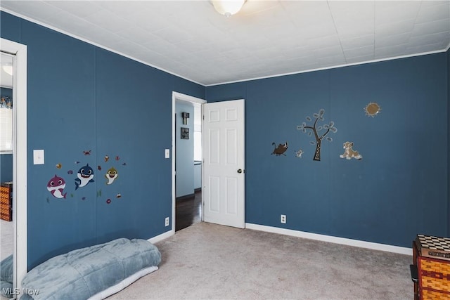 carpeted bedroom with baseboards